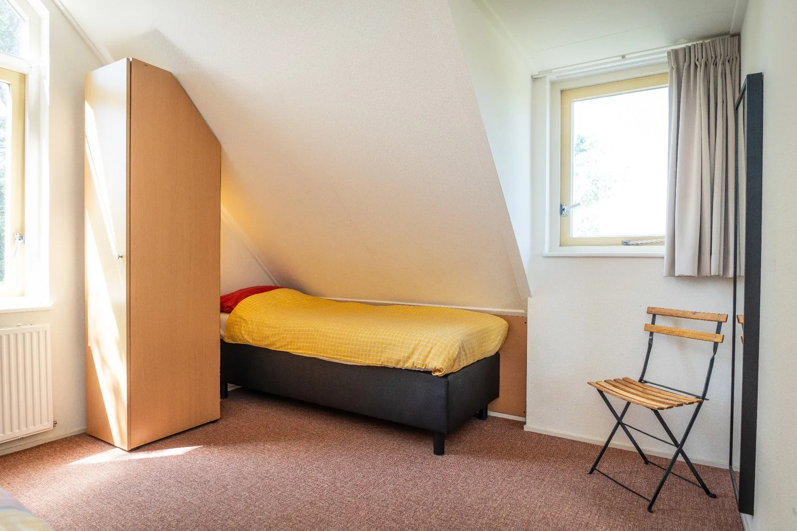Slaapkamer boven met meerdere slaapplaatsen in het vakantiehuis